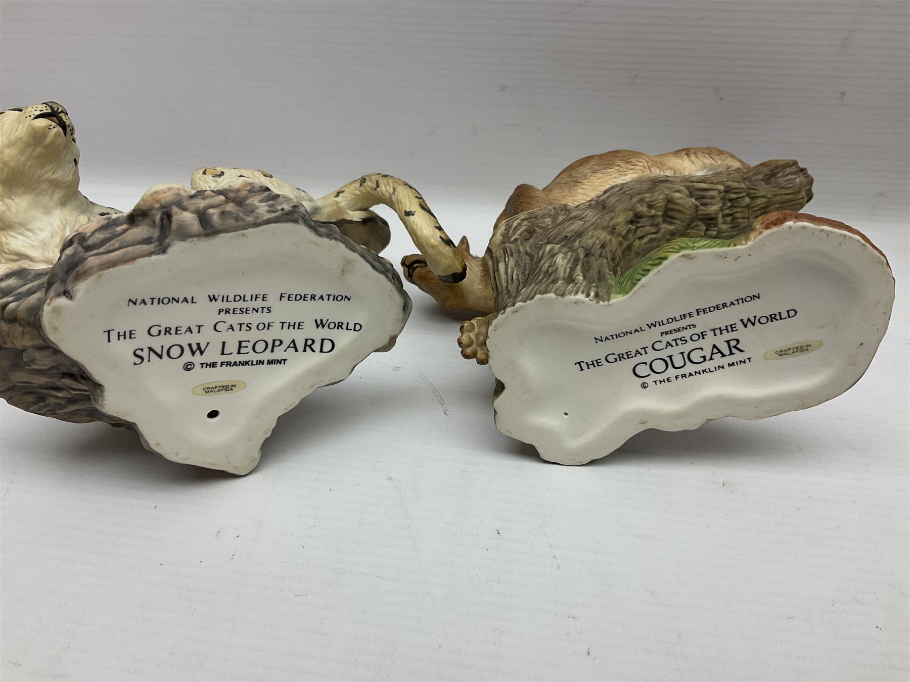 Ten Franklin Mint National wildlife Foundation Big Cats of the World figures to include, White Bengal Tiger, Jaguar, Cougar, Cheetah, Clouded Leopard etc, with display stand
