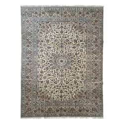 Persian Kashan ivory ground carpet, the field decorated with interlacing foliate branches and stylised plant motifs, scrolling border decorated with repeating palmettes, within floral pattern guard bands