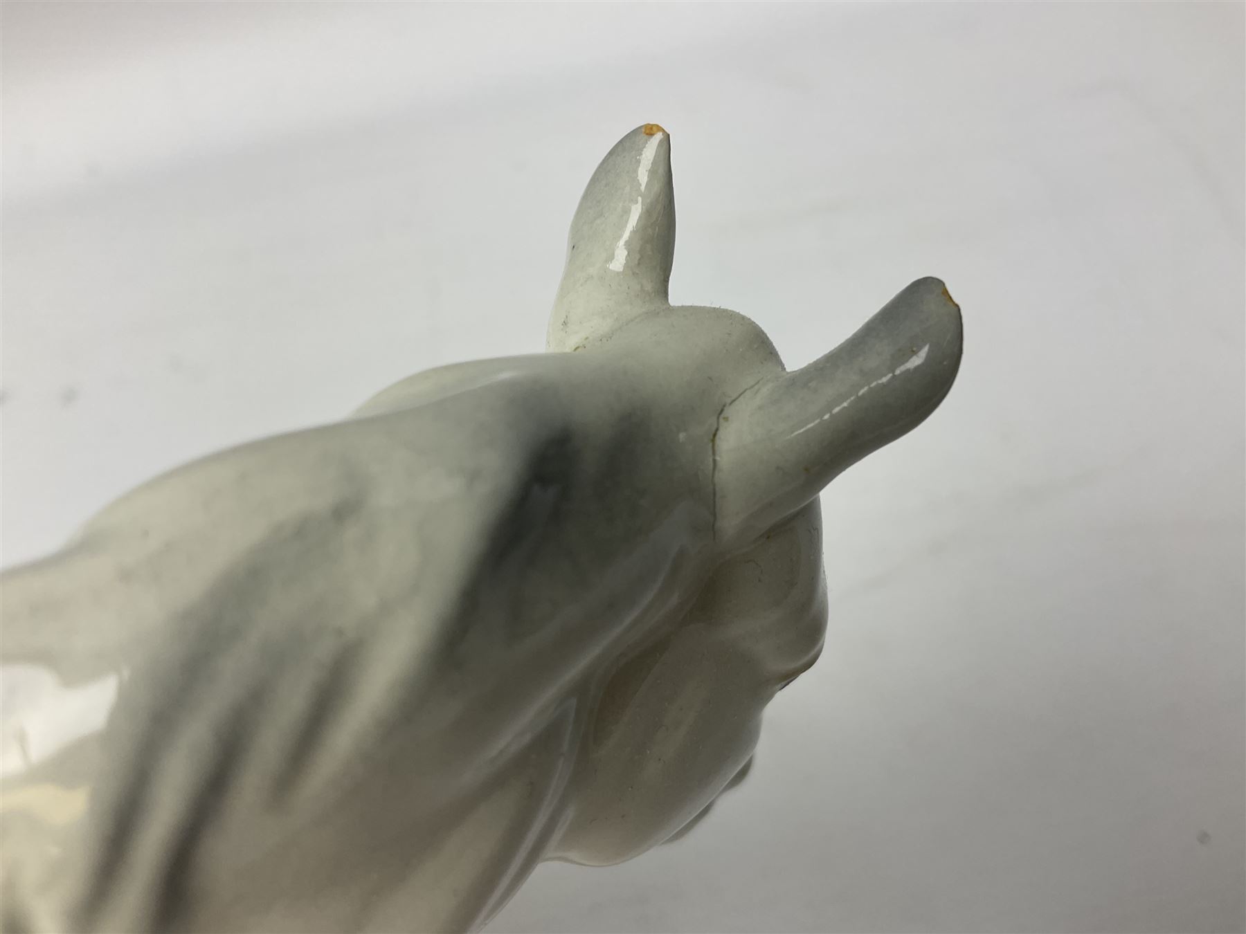 Collection of Beswick horses, including grey horse no.701, palomino foal no 836, grey stocky jogging mare no.855 etc, together two Royal Doulton horses, (8)