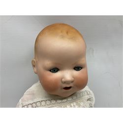 Heubach Koppelsdorf Germany bisque head doll with applied hair, sleeping eyes, open mouth with teeth and composition body with jointed limbs; marked 'Heubach Koppelsdorf 342.6/0 Germany' H34cm; Armand Marseille bisque head baby doll with moulded hair, sleeping eyes, open mouth and composition body with jointed limbs; marked 'A.M. Germany 351./8.K.; and BND London all composition doll (3)