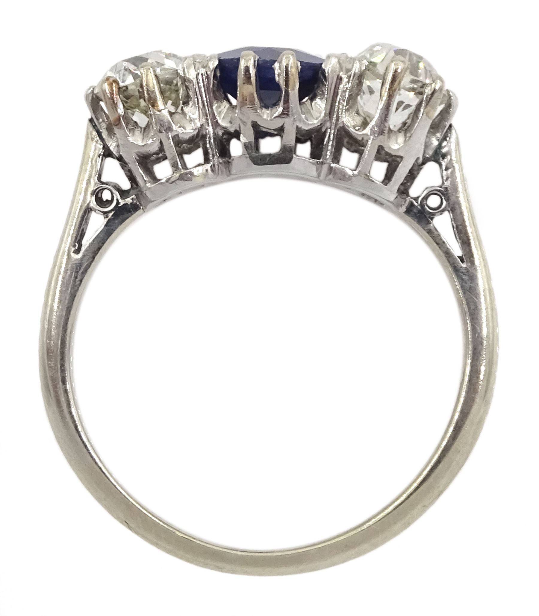 Early 20th century gold three stone old cut diamond and round sapphire ring, sapphire approx 0.60 carat, total diamond weight approx 1.00 carat