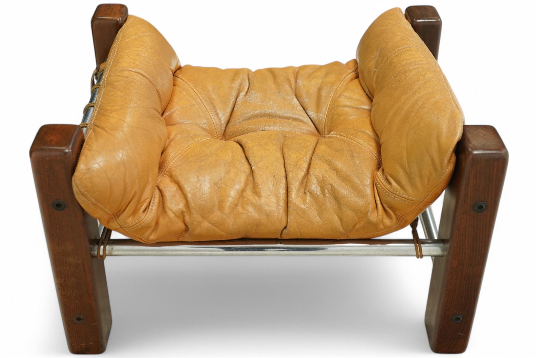 Jean Gillon (Romanian/Brazilian 1919-2007): 'Amazonas' easy chair, mahogany framed with slung leather upholstered cushions, together with matching footstool
