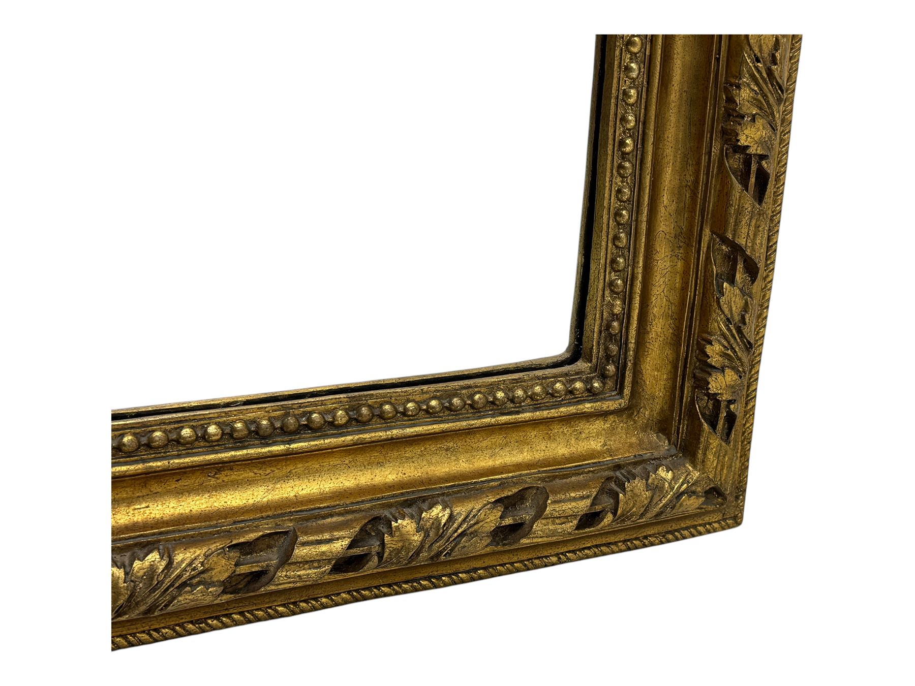 18th century design ornate gilt framed overmantle mirror, bevelled mirror plate within arched frame with pierced pediment featuring foliate and scrollwork designs