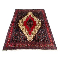 Persian Kurdish rug, blue ground field decorated with various stylised motifs and overlapped lozenge medallion, repeating guarded border