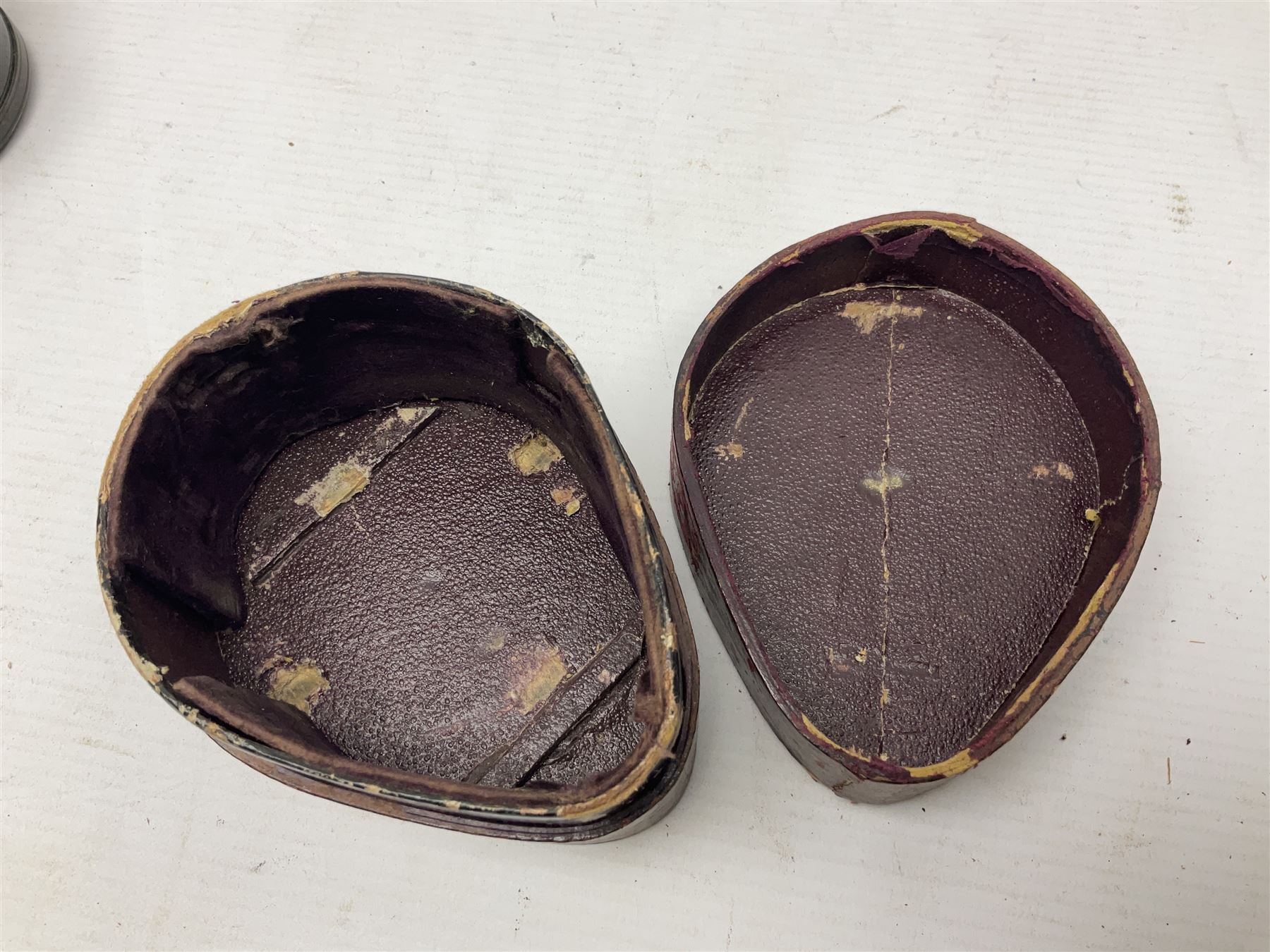 19th century Watkins combined clinometer and compass, patent 217, by J. Hicks Maker 8 Hatton Garden London No.5829, of drum shaped form in lacquered brass case D7cm; both instrument and case bear the name of former owner Thomas S.N. Hardinge; with early 20th century postcard caricature of a serviceman (2)