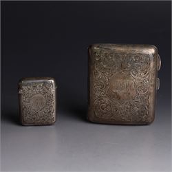 1920s silver cigarette case, with engraved initials and foliate decoration to cover and personal engraving to interior, hallmarked Smith & Bartlam, Birmingham 1924, with a similar silver vesta case, hallmarked, cigarette case H8.5cm