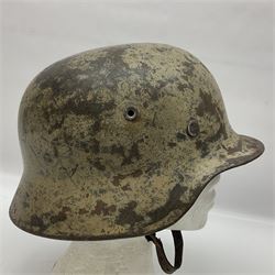 WW2 German Infantry M40 steel helmet with tropical finish and traces of single decal; with chin strap and leather liner marked 57 twice in red; back apron stamped 11 38
