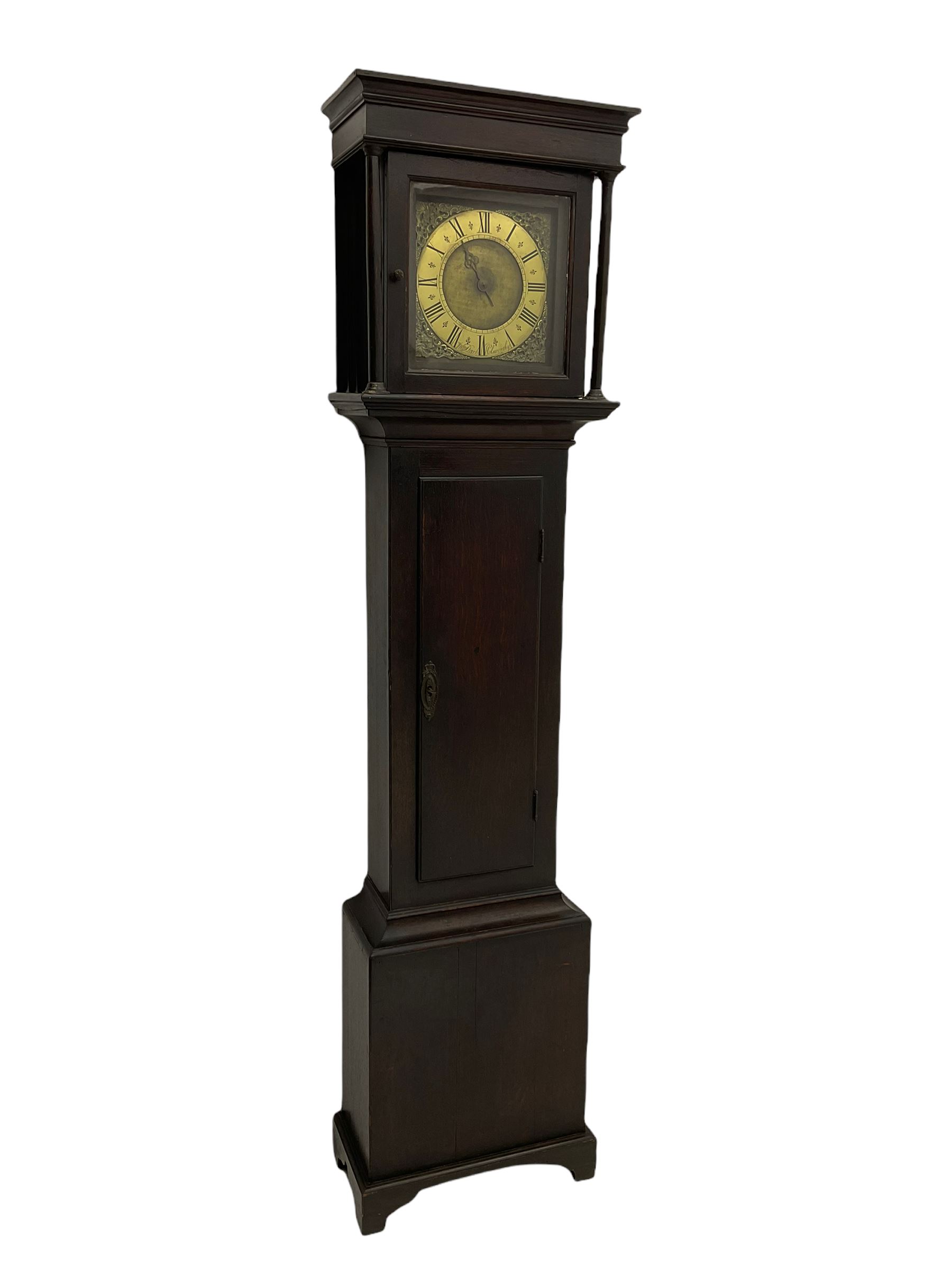 A mid-18th century 30-hour provincial longcase clock by John Darke of Holdsworthy (Devon), in an oak case with a flat-topped pediment, square hood door flanked by two free standing pillars with brass capitals, trunk with a flat-topped full-length door on a rectangular plinth with applied shaped skirting, a 9-1/2” square brass dial with a matted centre and brass (unsilvered) chapter ring, engraved with roman numerals, half and quarter hour divisions, single steel hand and 
