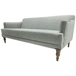 Victorian design three seat sofa, upholstered in pale blue textured fabric, on turned front supports