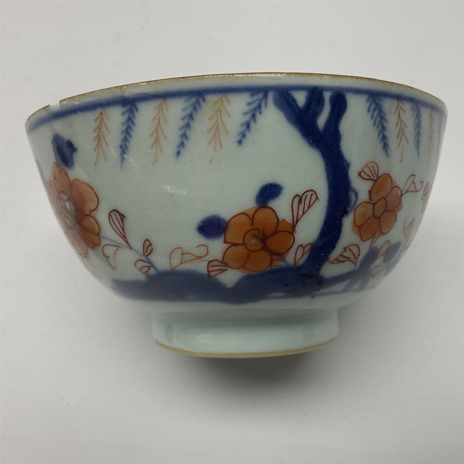 Chinese ceramic bowl, painted with floral and foliate decoration on a white ground, together with a similar much smaller Chinese bowl, painted with mountain scene to centre and covered by basket weave to exterior and a white metal mounted pear shaped scent bottle, largest bowl D11cm