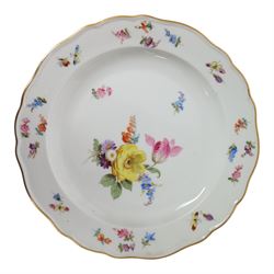 Four early 20th Century Meissen plates, hand painted with floral sprays, sprigs and inspects, with underglaze blue cross sword mark beneath, D21.5cm