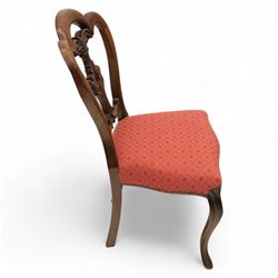 Set of four Victorian walnut balloon back chairs, with a carved and pierced back splat with foliate scrolls, serpentine seat upholstered in a diamond pattern fabric, raised on cabriole legs 
