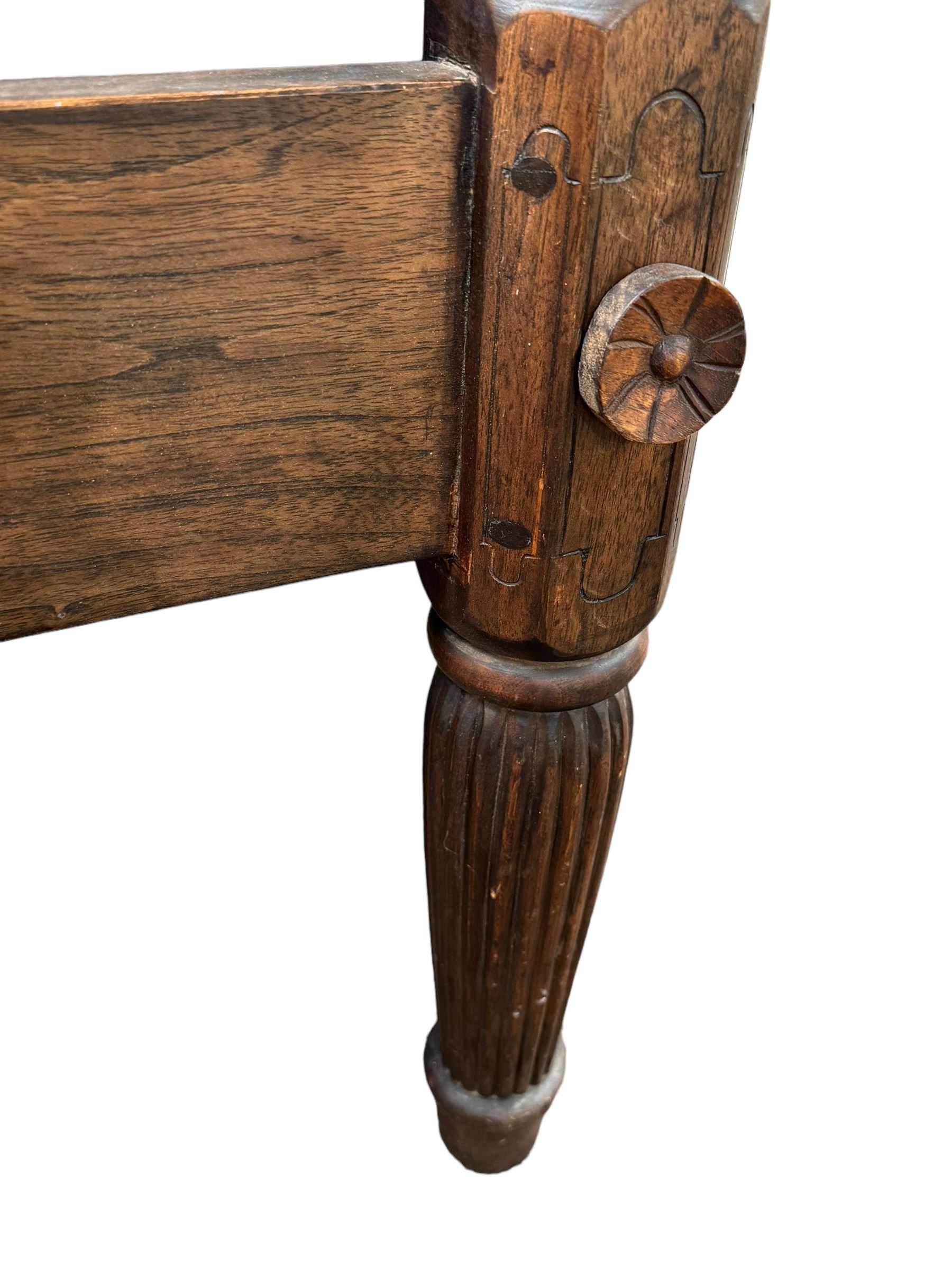 Georgian design Indian sheesham hardwood framed four poster bed, lattice slats to the top supported by reeded cylindrical and octagonal column uprights, the pierced stepped headboard carved with floral motifs, with associated mattress