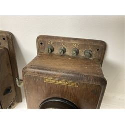 Two Hunningscone patent wall mounting telephones in walnut casing, together with Sterling Telephone & Electric Co. Ltd early wall-mounted telephone 'Primax' and one other 