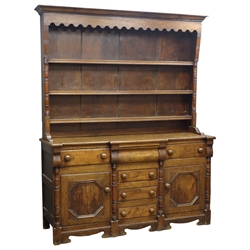 19th century oak dresser, raised three tier plate rack with turned half column uprights, six drawers and two cupboards with geometric moulding, W167cm, H206cm, D51cm  