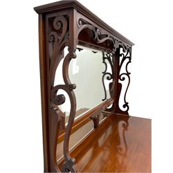 Late Victorian walnut mirror back dresser, projecting cornice over pierced scrolls and central leaf motif, shaped and bevelled sectional mirror back, break bow front fitted with three drawers and to cupboards, shaped apron and cabriole supports carved with foliage 