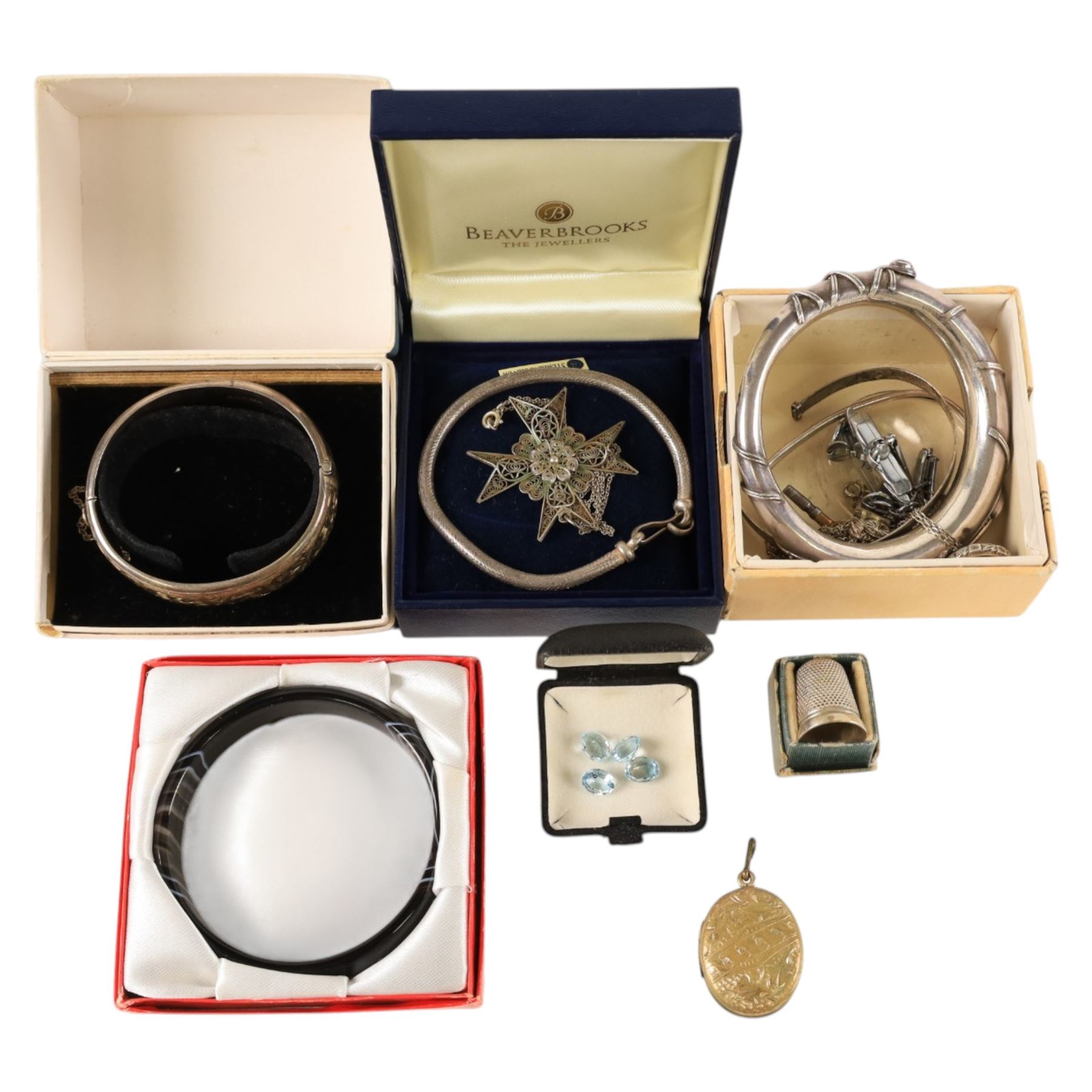 Silver jewellery, including bangles, heart locket, fob, silver thimble, costume jewellery and four loose stones