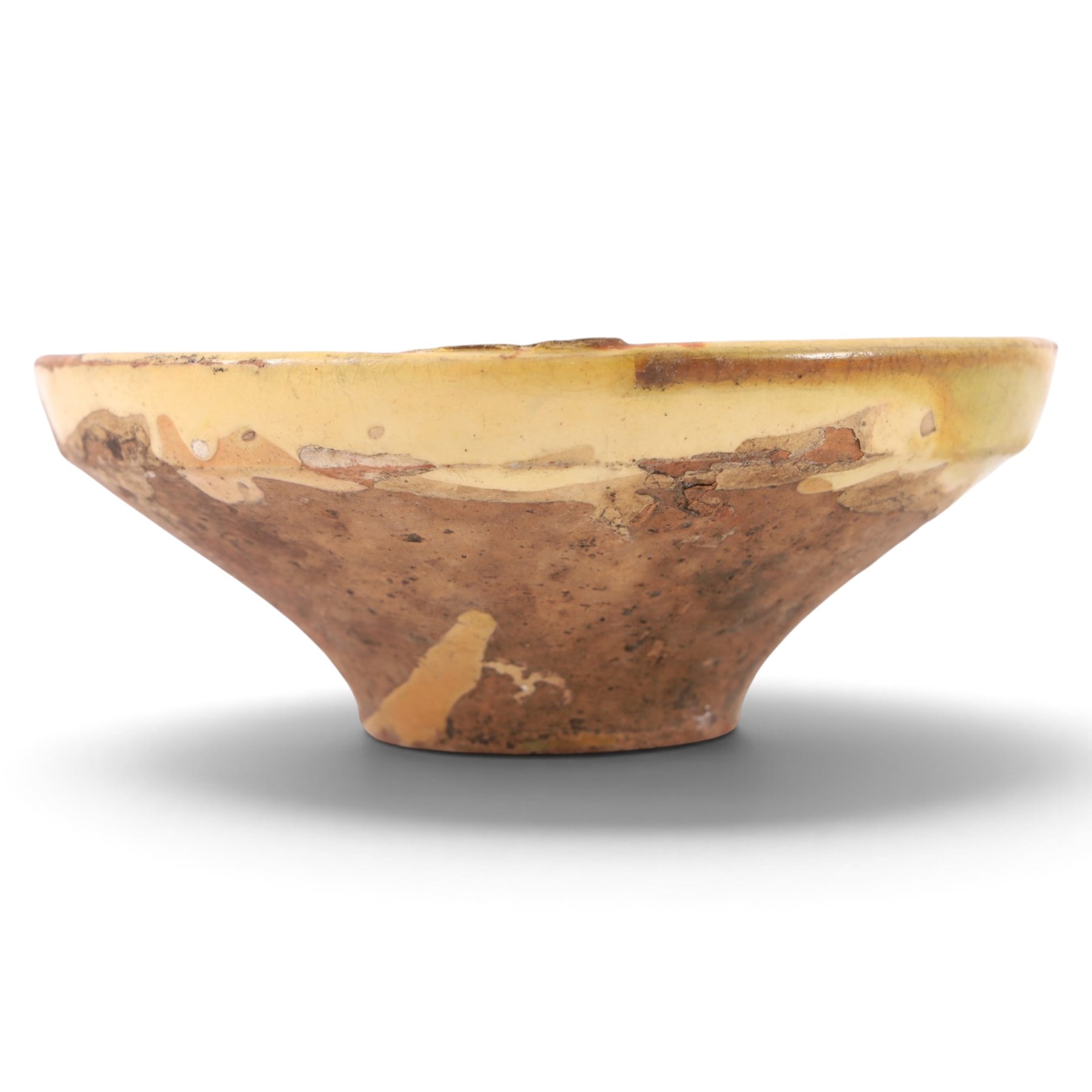 Spanish twin handled cooking pot, blackened to the outside, together with two bowls with slipware glaze, pot H22cm 