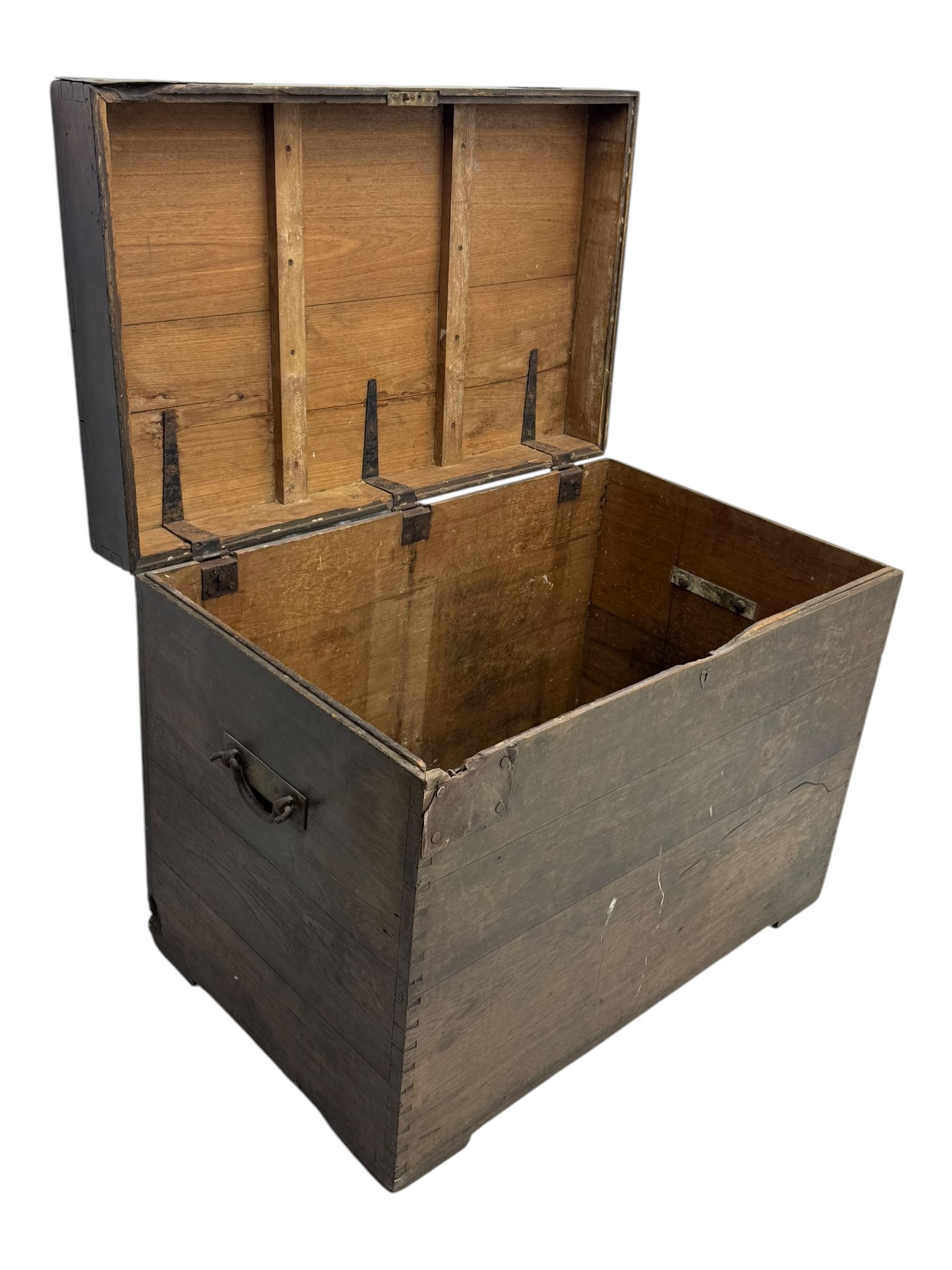 Early 20th century oak blanket chest, of rectangular form with iron strap hinges and surface-mounted drop handles, the interior fitted with iron lid stays, on bracket feet