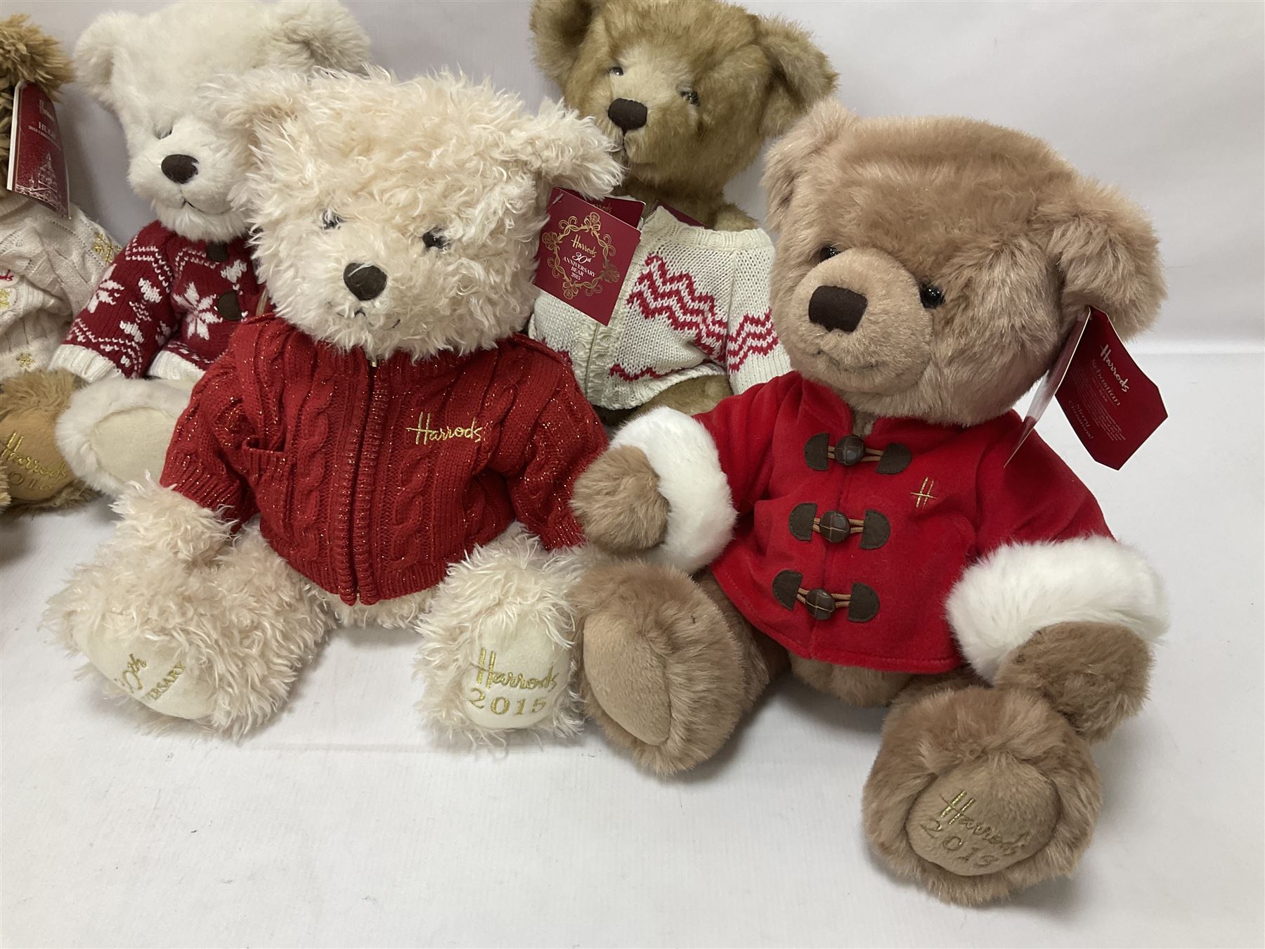 Six Harrods annual teddy bears, dating between 2011 and 2016, tallest H38cm