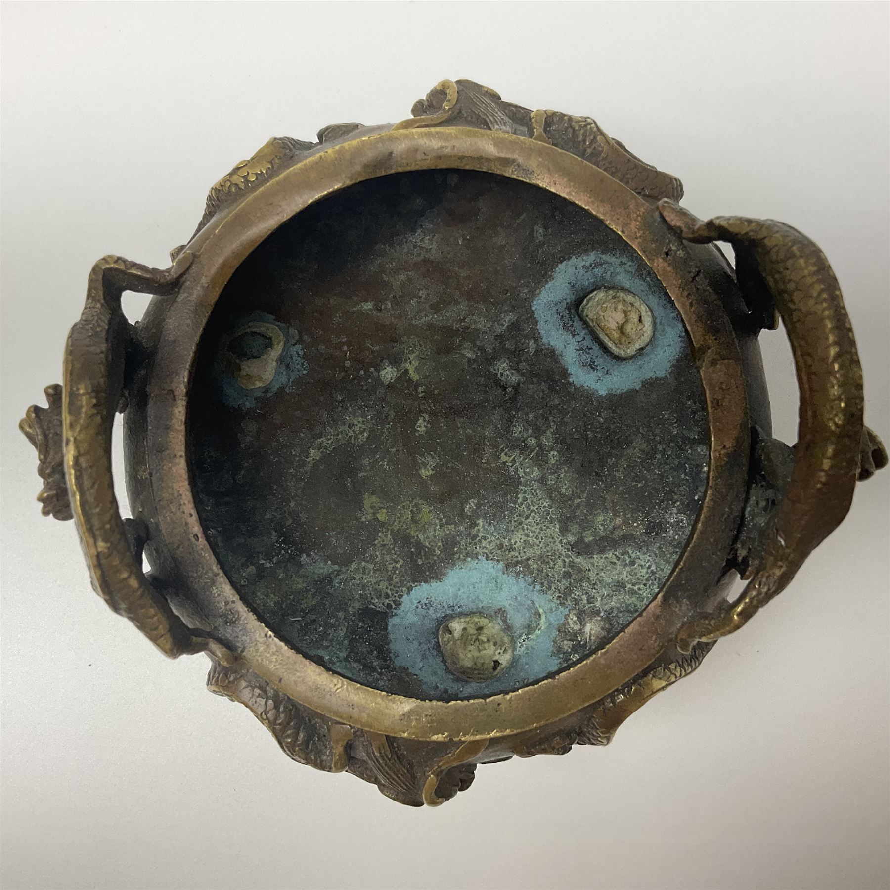 Chinese cast brass censer, with applied dragon twin handles and decoration, raised upon three feet with character mark beneath, D12cm H9.5cm