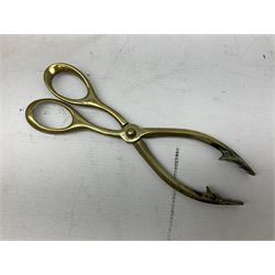 Cast iron fire companion set modelled as a knight in armour with fleur-de-lis shield and sword concealing fire poker, with brass tongs to reverse, raised upon stepped rectangular base, H55cm