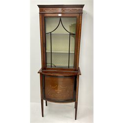 Edwardian inlaid mahogany display cabinet, single glazed door enclosing two lined shelves, above single cupboard, square tapering supports