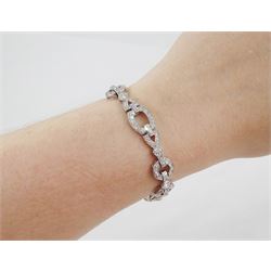 Art Deco platinum diamond bracelet, circa 1920, articulated openwork circular and geometric links, milgrain set with old cut diamonds and baguette cut diamonds, total diamond weight approx 3.85 carat