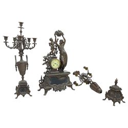 Vincenti and Cie - late 19th century figural clock garniture, cast figures in patinated bronze on a rectangular rococo plinth with splayed feet, drum cased Parisian 8-day twin train movement with an enamel dial, Arabic numerals and minute markers, striking the hours and half hours on a bell. With matching candelabra.  Garni H 70cm.  