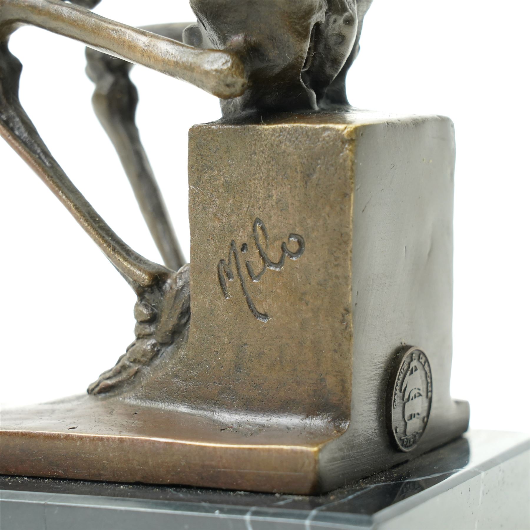Bronze skeleton modelled as 'The Thinker', on black marble base, signed 'Milo' to plinth, H15cm