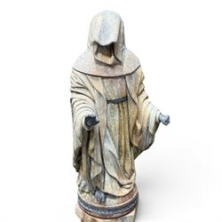 Farran stone garden statue depicting a hooded monk standing in flowing robes in circular form, set upon Gothic pedestal with arched panels, featuring lead hands and script band