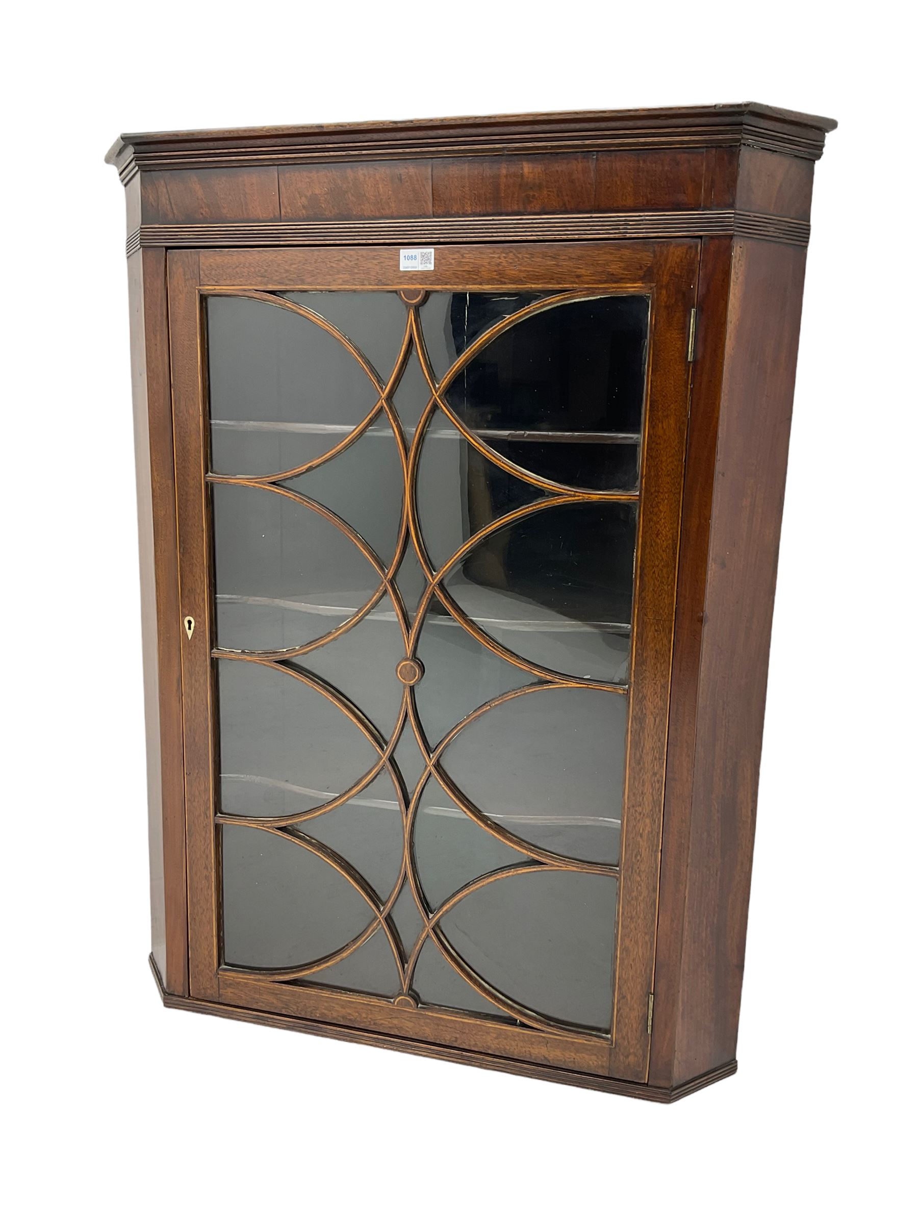 Georgian mahogany wall hanging corner cabinet, enclosed by single door with curved interlacing astragal glazing 