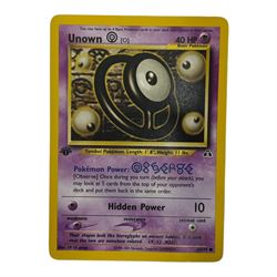 Collection of mainly vintage Pokemon cards including Charizard Base Set Holographic number 4/102 and two Ancient Mew 2000 promo cards, some housed within plastic wallets and some loose