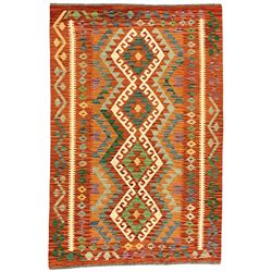 Anatolian Turkish Kilim amber ground rug, the field decorated with four lozenges with ivory outline, the double banded orange border with repeating geometric patterns 