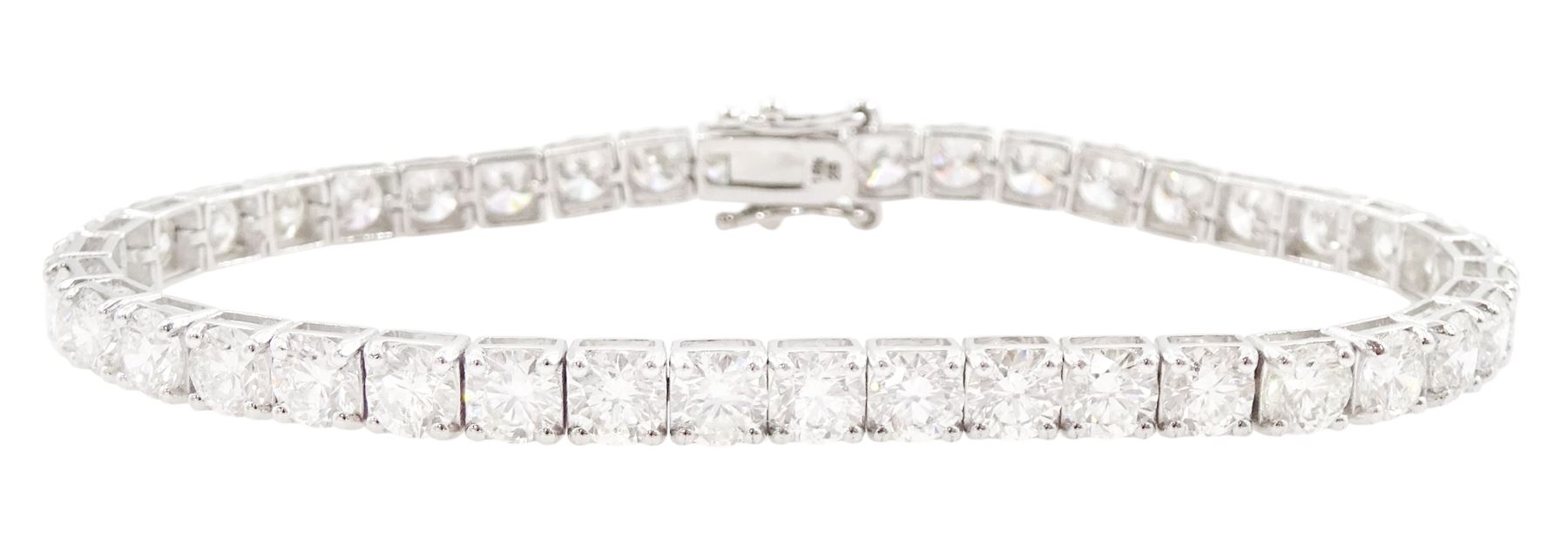 18ct white gold diamond bracelet, forty round brilliant cut diamonds , in a four claw setting, stamped 18K, total diamond weight 12.26 carat, with World Gemological Institute report