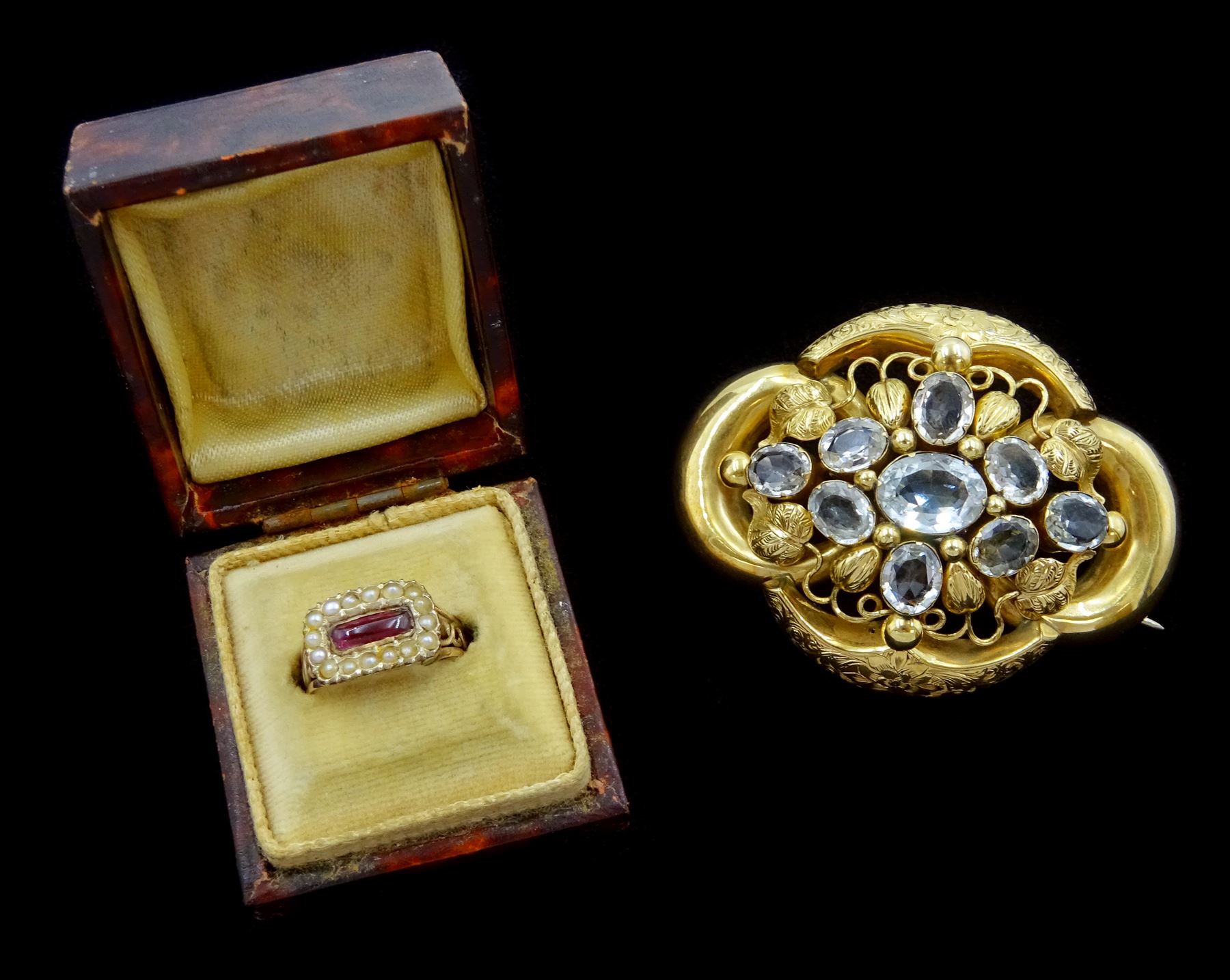 Victorian 9ct gold oval cut blue topaz brooch and a 9ct gold Victorian cabochon garnet and seed pearl ring