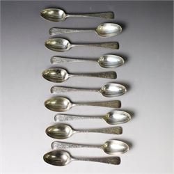 Eleven Victorian silver teaspoons, profusely engraved with floral decoration throughout wi...
