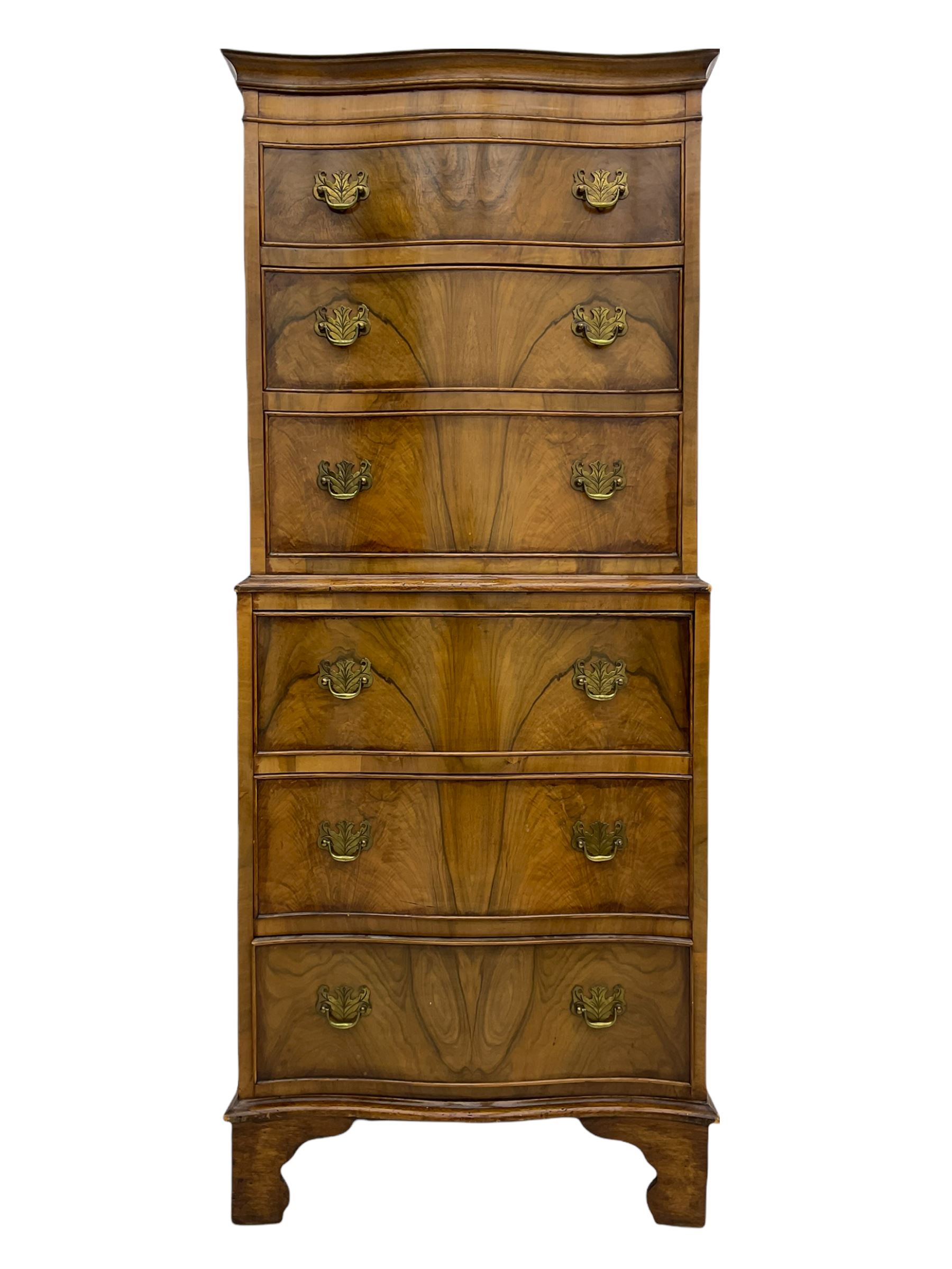 Burton Reproductions walnut chest on chest, fitted with six serpentine drawers