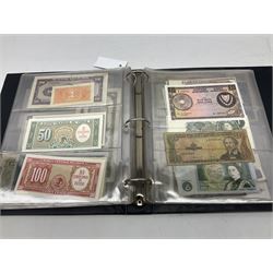 World banknotes, including Queen Elizabeth II The States of Jersey one pound 'DB202703', five pounds 'BB527762' and ten pounds 'AB651481', reserve bank of New Zealand two dollars '1L3 741894', King George V Straits Settlements one dollar 1st January 1935 'F/83 28924', various Bank of England notes etc, housed in two ring binder albums