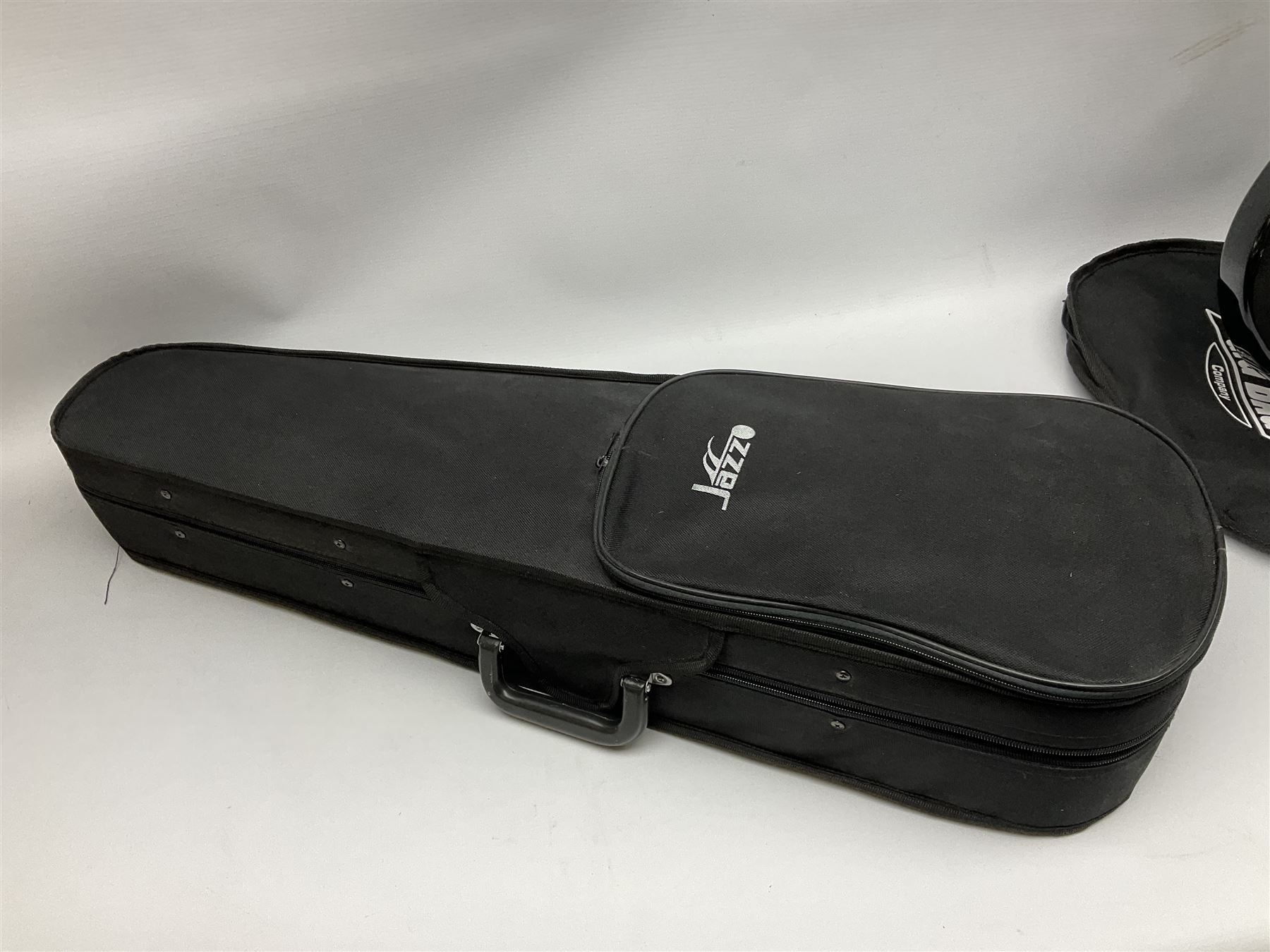 Dean small or child's size electric guitar in black, serial no.O09121956 L85cm; in gig bag; and modern student's violin with 35.5cm two-piece back in fitted carrying case with older bow (2)