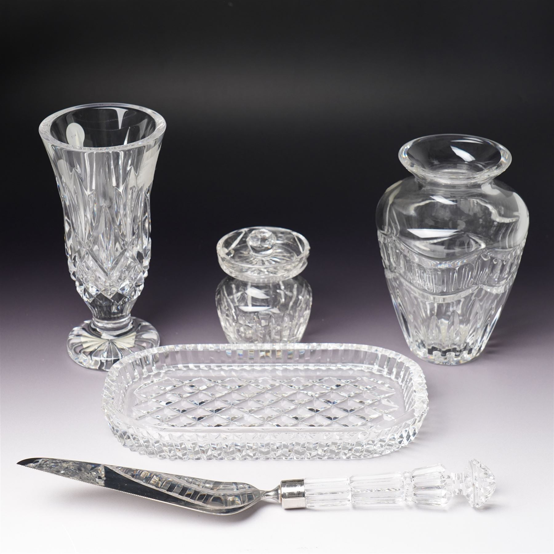 Waterford Crystal 'Pompeii' vase, boxed, H15cm, a Waterford 'Archive' vase, boxed, H18cm, and a collection of other Waterford items, including an ashtray, cake slice, and covered pot (5)