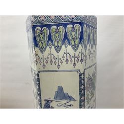 Oriental hexagonal walking stick stand, decorated with panels depicting mountain scenes and birds, together with walking sticks and umbrellas, stand H62cm 