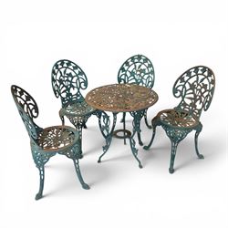 Cast iron garden table and four chairs, in the Art Nouveau style, with pierced floral and foliate decoration throughout, circular table raised on four cabriole legs with stretcher ring, chairs with shaped openwork backs and seats, in a weathered green finish