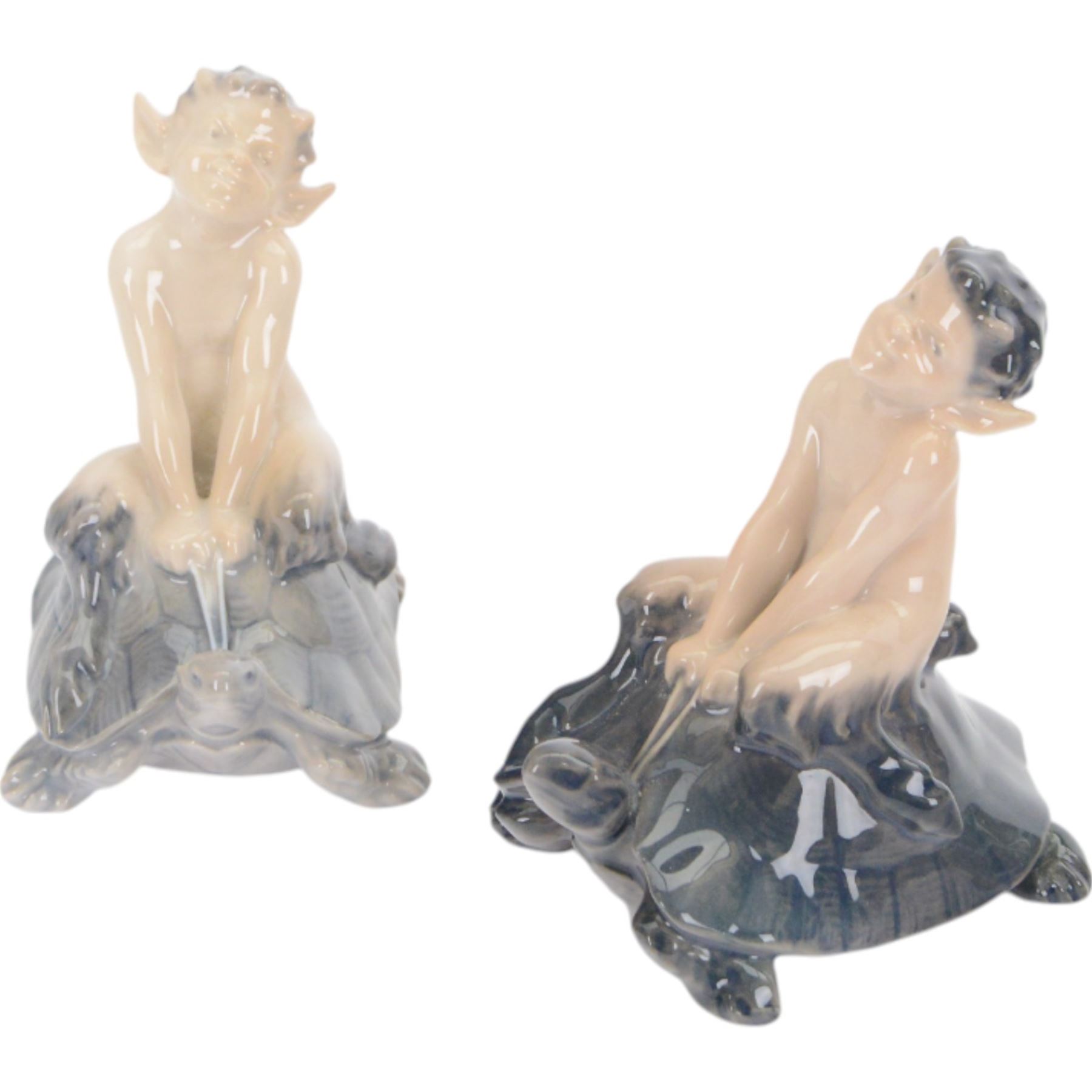 Four Royal Copenhagen figures, comprising Faun with Goat no 498, Faun with Rabbit no 439 and two faun riding on tortoise going fast no 858