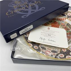 Limited edition Royal Crown Derby Christmas plate, depicting a cat sleeping by a fire, the third plate in an original series of four, no 584/1750, boxed