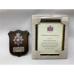 Archive of memorabilia and ephemera relating to Pc. (later Sgt.) Geoffrey Robinson of Dewsbury (later West Yorkshire) police force including cased Long Service and Good Conduct Medal; helmet plates and cap badges, collar numbers and uniform buttons, whistles, certificates, photographs, plaque etc 1960s - 1990s