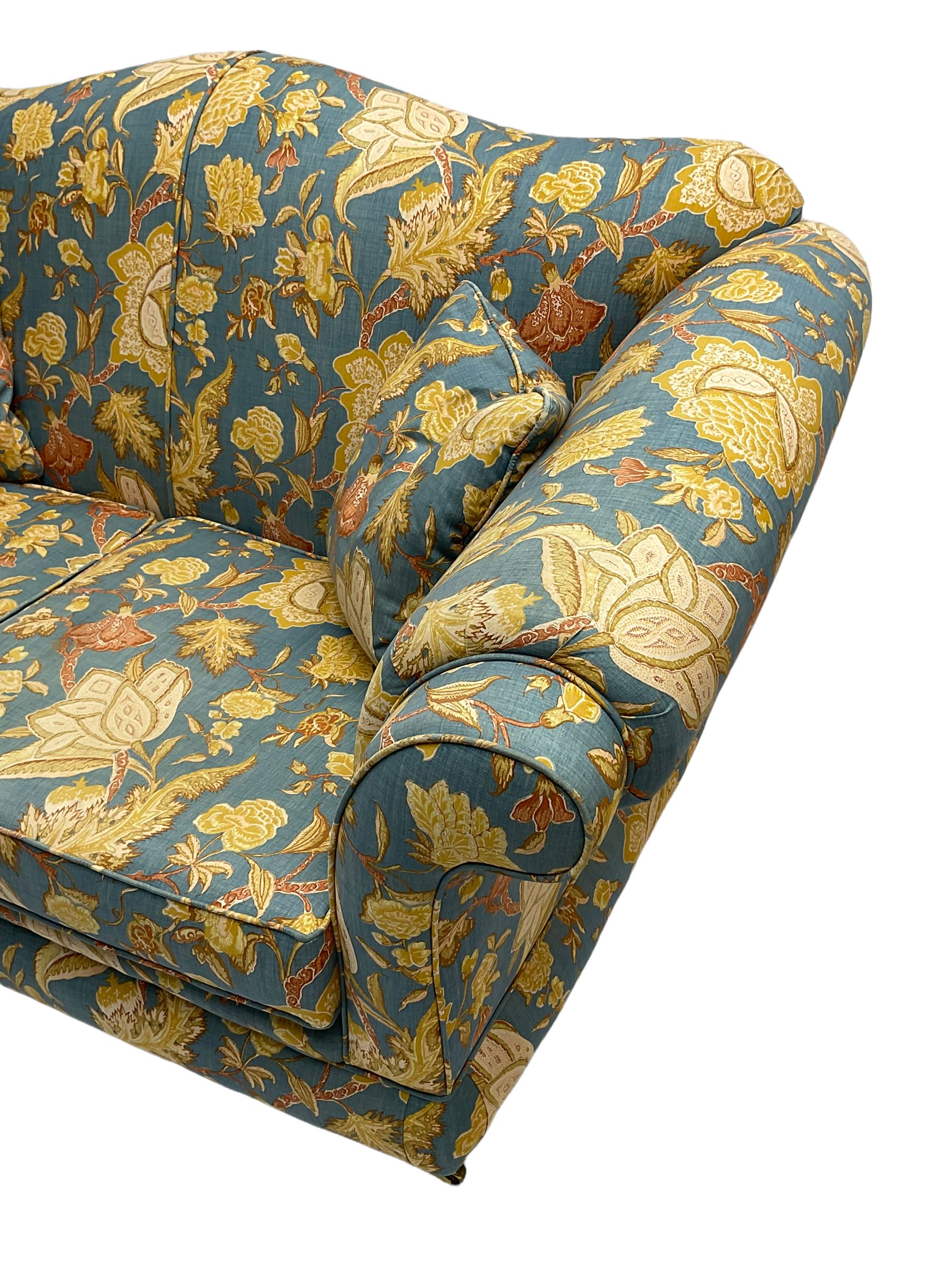 Lincoln House - two seat sofa (W170cm), wingback armchair (W94cm), and armchair (W90cm), upholstered in blue ground fabric with floral pattern