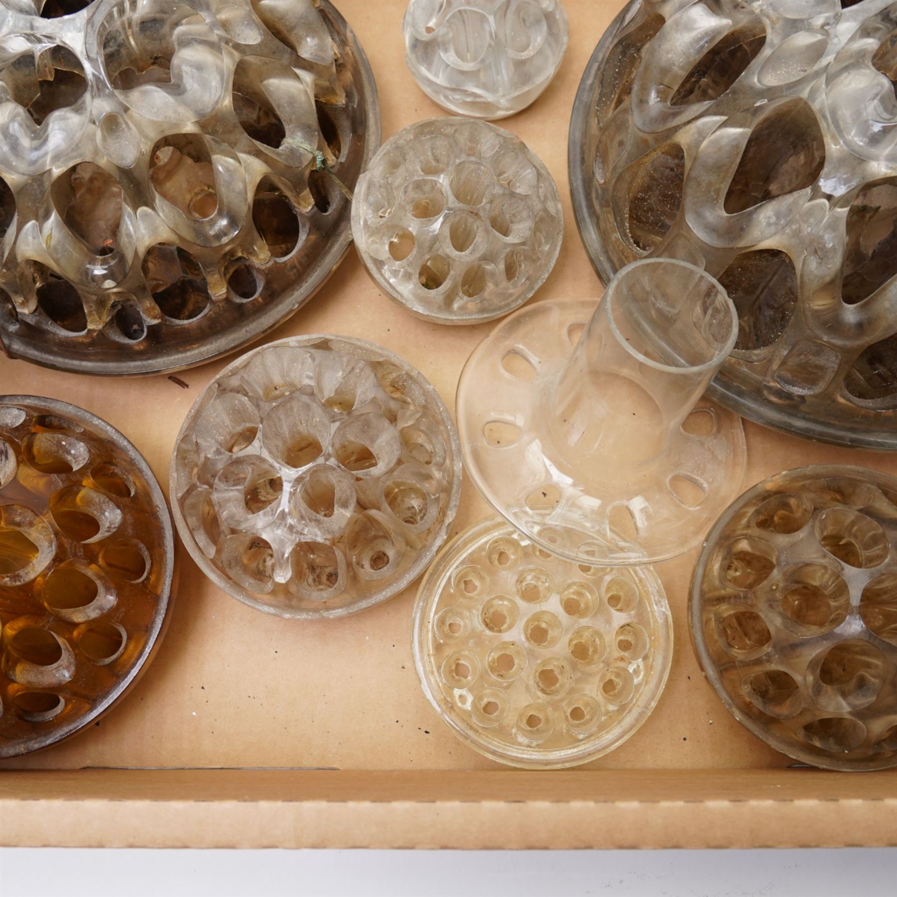 Ten glass pique fleurs or flower holders, in one box 
Provenance: from the Kirkham Hall estate. 