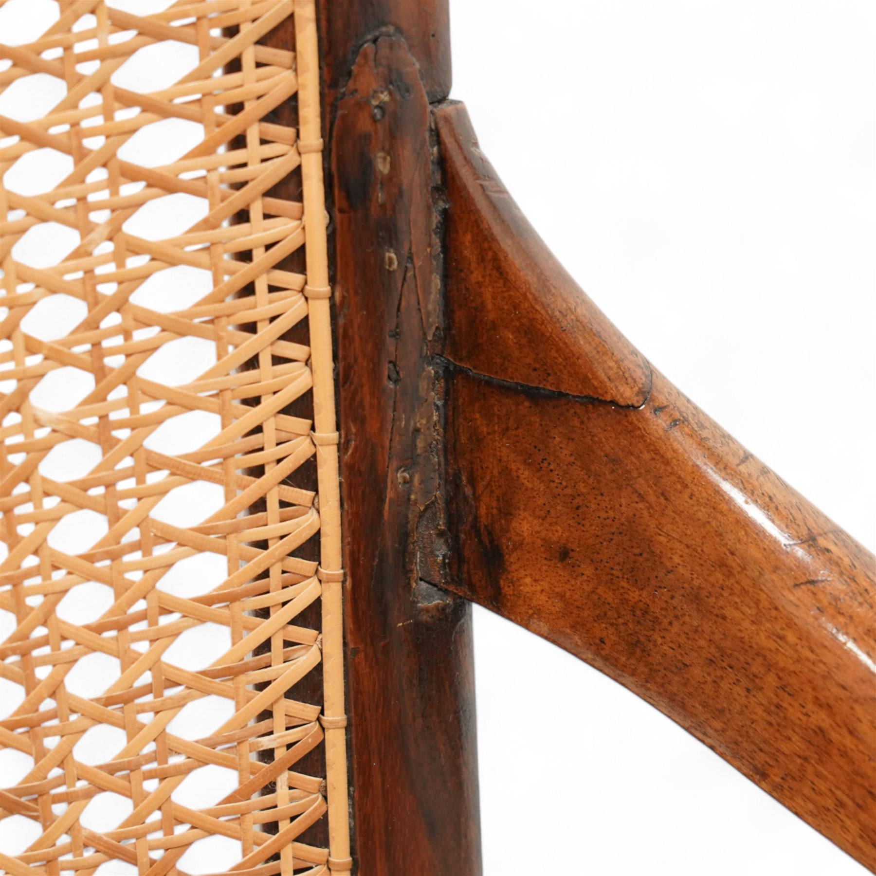 Victorian stained beech frame open armchair, arched cane work back and seat, on turned supports with splayed feet united by turned stretchers 