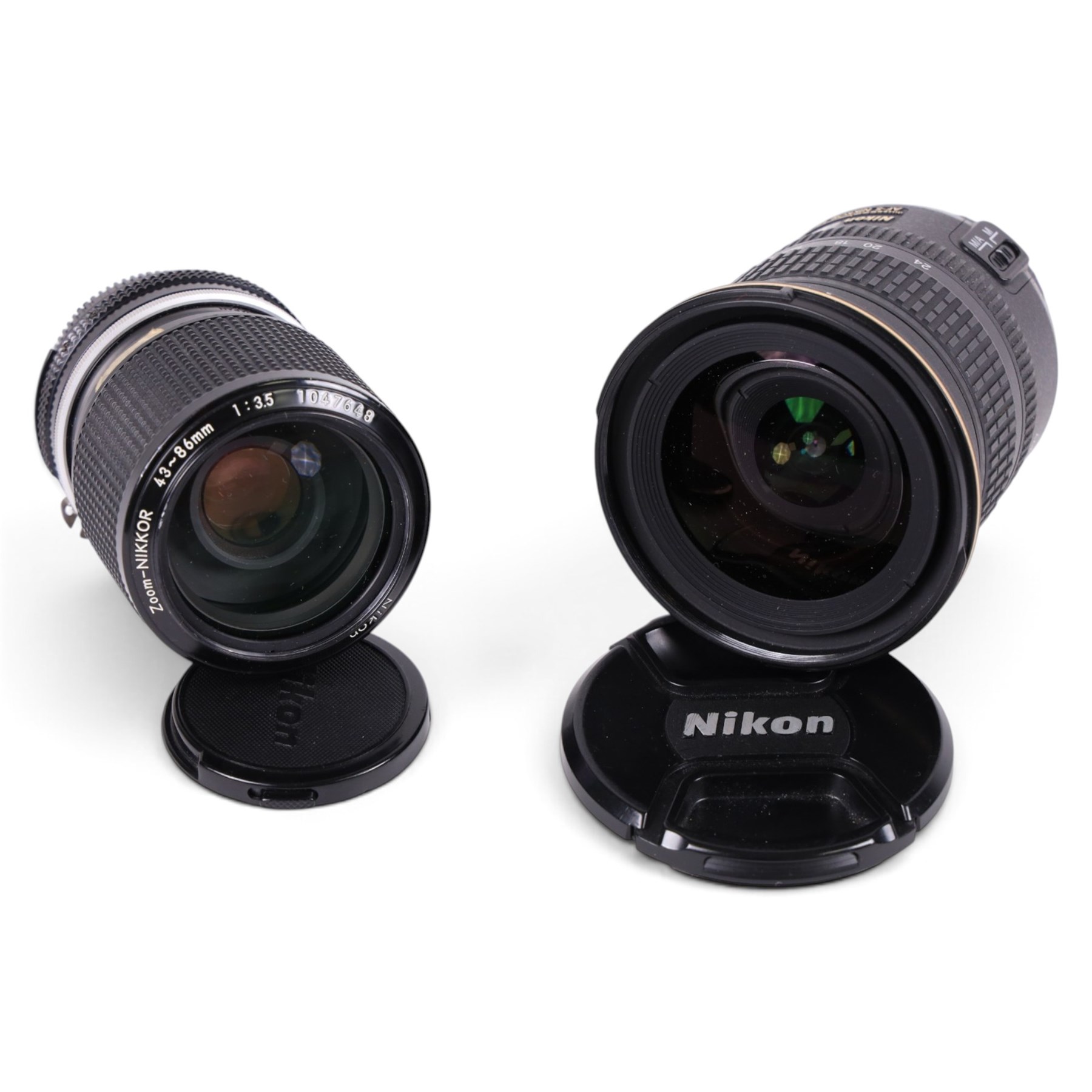 Two Nikkor lenses, comprising AF-S DX 12-24mm 1:4G ED serial no. 259461 and Zoom-Nikkor 43-86mm 1:35 zoom serial no. 1047648